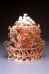 Image of the porcelain paper clay work Red Covered Bowl on Trivet by Jerry L. Bennett.